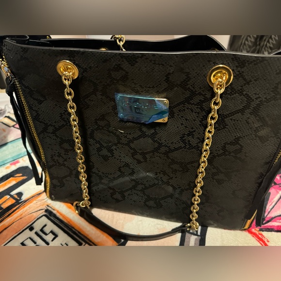 Like new Bebe black snack print tote/ shoulder bag with gold chain straps - Picture 2 of 14